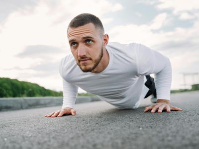 Close-up on a person's stable core during a bodyweight exercise.
